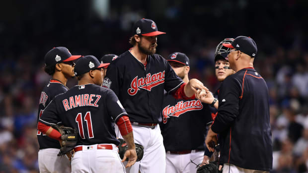 Nov 2, 2016; Cleveland, OH, USA; Cleveland Indians relief pitcher Andrew Miller hands the ball to manager Terry Francona in the 7th inning in game seven of the 2016 World Series against the Chicago Cubs at Progressive Field. Mandatory Credit: Ken Blaze-USA TODAY Sports